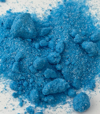 Close-up of blue potion powder that have a sand like appearance